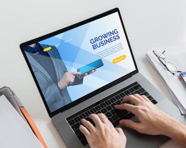 Growing Businnes website displayed on a laptop